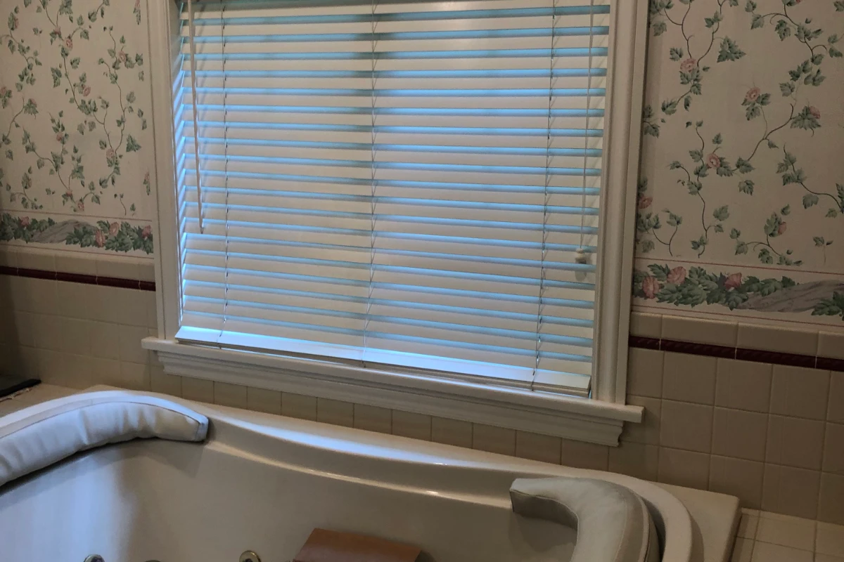 Outdated wallpaper before bathroom remodel in Dallas, PA