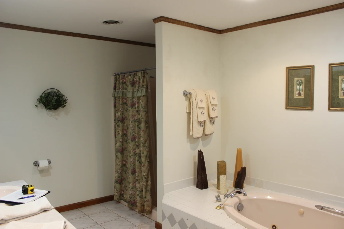 Dated platform tub before removal in a Scranton, PA bathroom