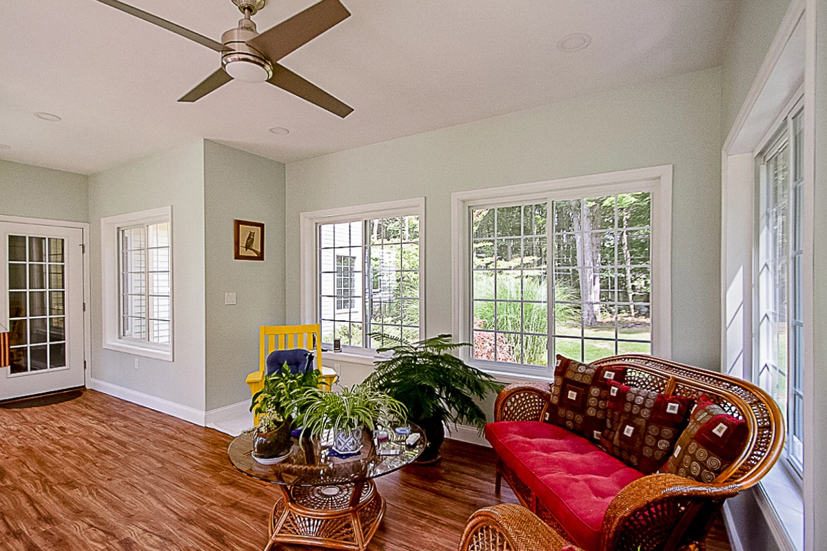 Bright sunroom seating area with plants in Moosic, PA