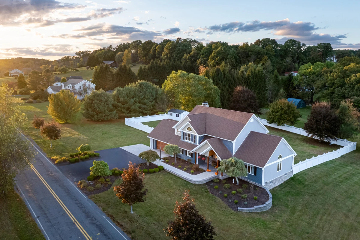 Blue board-and-batten siding remodel in Harding, PA by Perez DBR