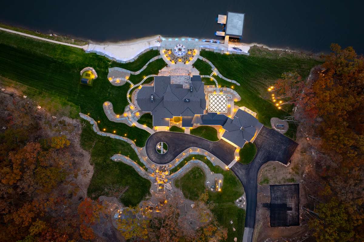 Aerial view of pool, firepit, and landscaped outdoor living area in Newton Ransom, PA