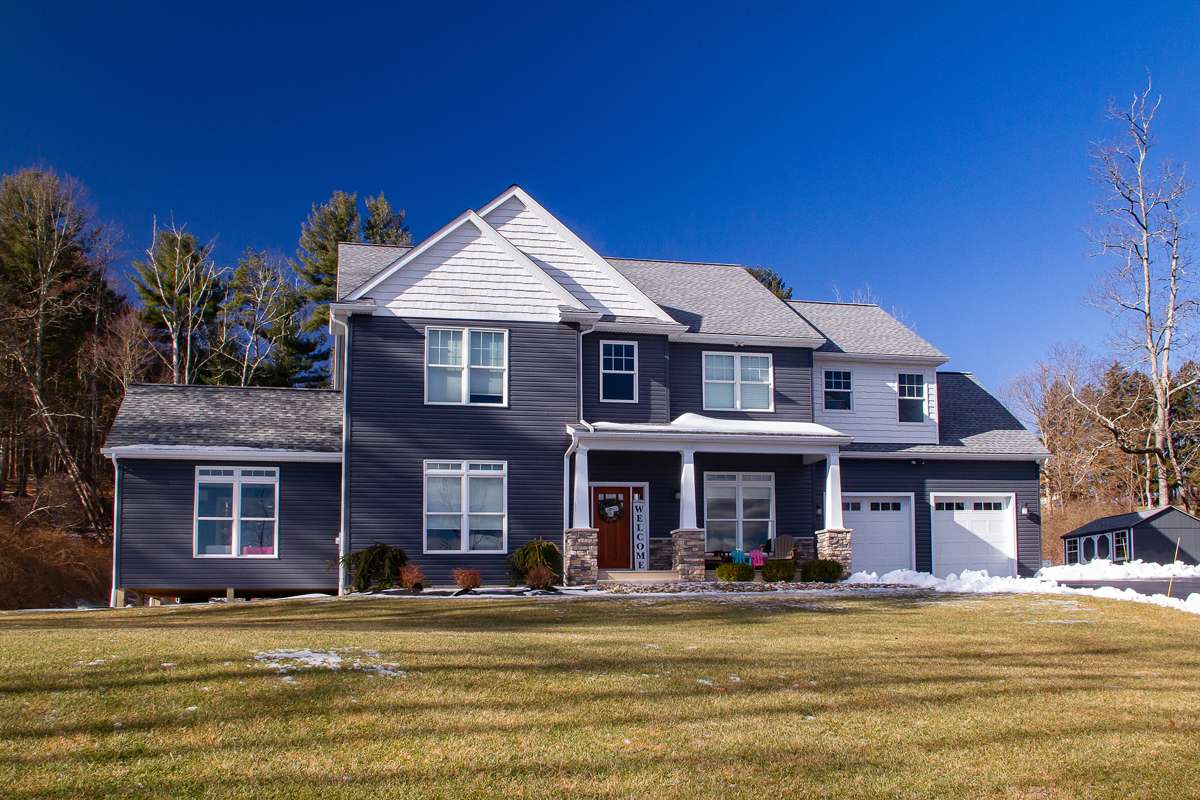 Family room addition in Dallas, PA matched to the original home by Perez DBR