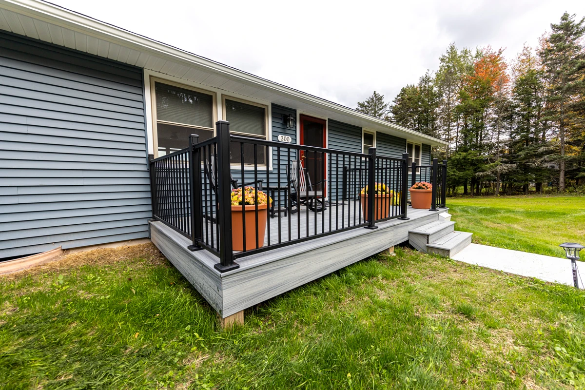 Pacific Blue siding and new deck on a Poyntelle, PA lake home remodel