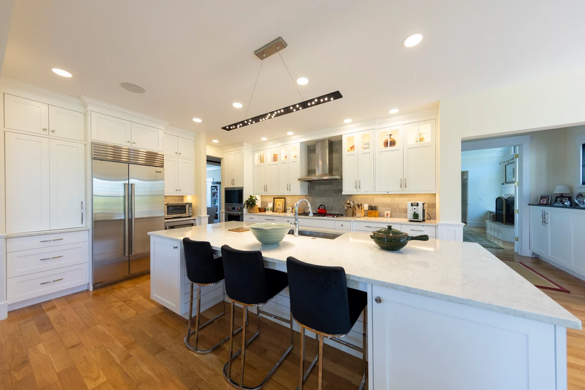 Open-concept living space with gallery walls in a Waverly, PA custom home